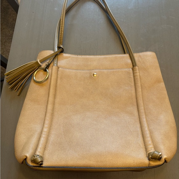Anthropologie Beige Shoulder Bag with Tassel and gold hardware